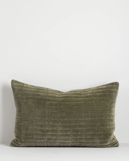 Quilted green cushion on white background