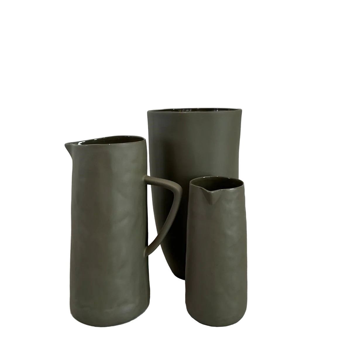 Three khaki green ceramic pitchers and vase with a plain background