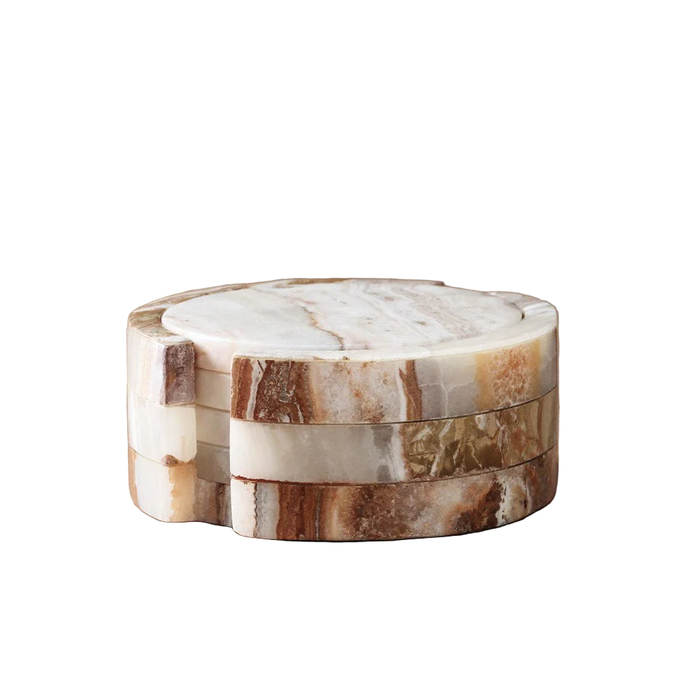 Stack of marble coasters on a white background
